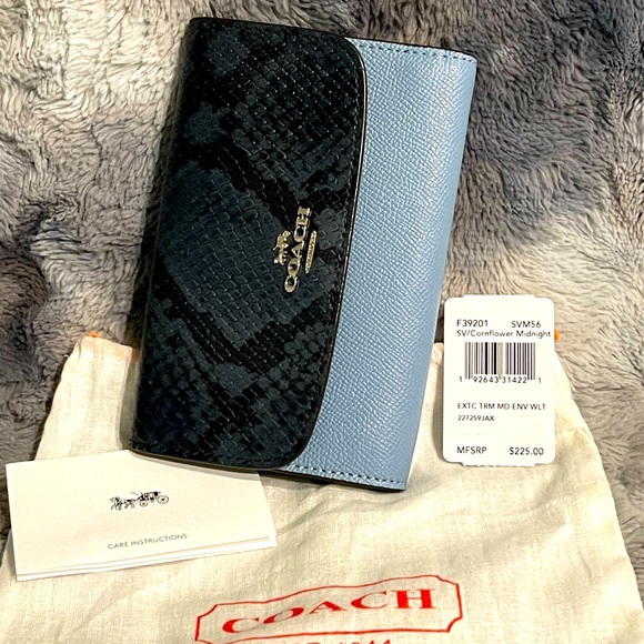 Coach Handbags - ❌SOLD❌ Coach Wallet blue and black, silver hardware. Used once in new condition.